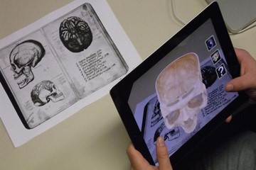 A tablet in which an augmentation of a skull can be seen. Creative commons